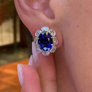 Sleek Bezel Oval Cut Royal Blue Sapphire Stud Earrings