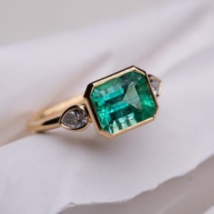 Golden Three Stone Emerald Sapphire Engagement Ring