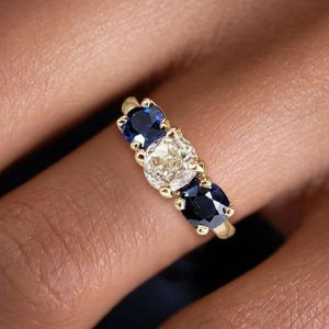 Golden Three Stone Cushion Cut White & Blue Sapphire Wedding Band For Women 