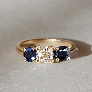 Golden Three Stone Cushion Cut White & Blue Sapphire Wedding Band For Women 