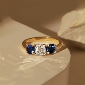 Golden Three Stone Cushion Cut White & Blue Sapphire Wedding Band For Women 