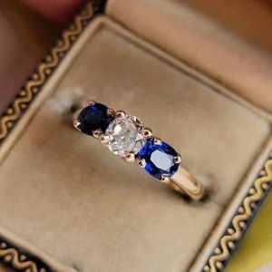 Golden Three Stone Cushion Cut White & Blue Sapphire Wedding Band For Women