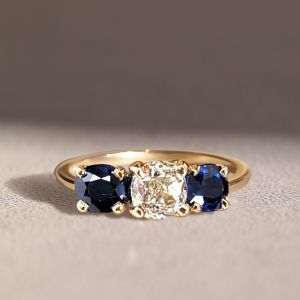 Golden Three Stone Cushion Cut White & Blue Sapphire Wedding Band For Women 