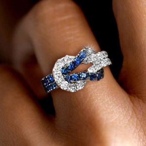 Infinity Design Two Tone Round Cut Blue Sapphire Wedding Band For Women