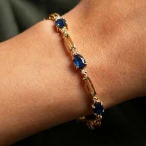 Gold Oval Cut Blue Sapphire Tennis Bracelet For Women