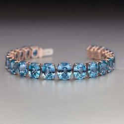 Classic Rose Gold Oval Cut Blue Sapphire Tennis Bracelet