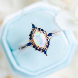 Rose Gold Halo Oval Cut Opal & Blue Sapphire Engagement Ring