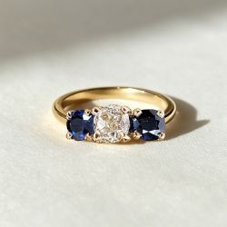 Golden Three Stone Cushion Cut White & Blue Sapphire Wedding Band For Women 