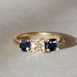 Golden Three Stone Cushion Cut White & Blue Sapphire Wedding Band For Women 