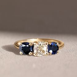 Golden Three Stone Cushion Cut White & Blue Sapphire Wedding Band For Women 