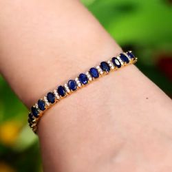 Golden Oval Cut Blue Sapphire Tennis Bracelet For Women