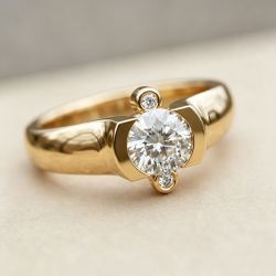 Three Stone Golden Bezel Round Cut White Sapphire Engagement Ring For Women